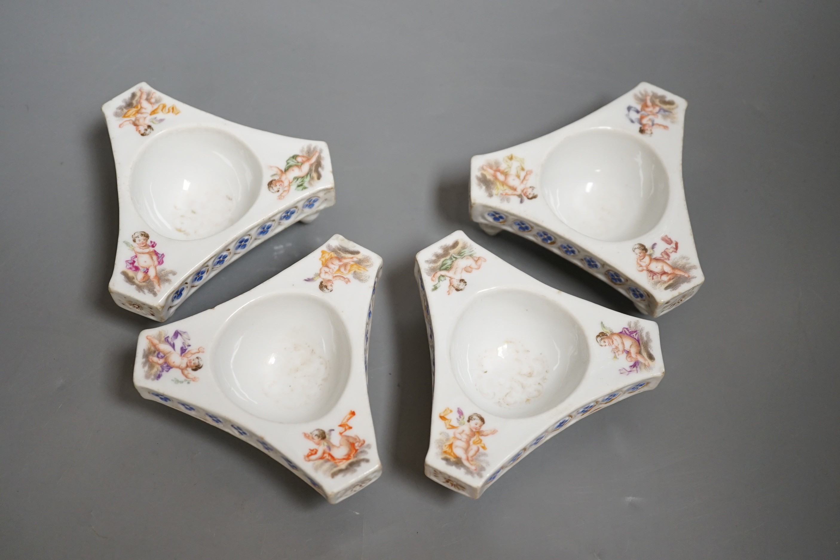 Four late 19th century Dresden porcelain tripod salts, by Helena Wolfsohn, 10cm wide